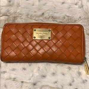 Michael kors orange wallet.
